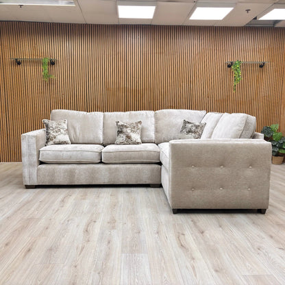 Lifestyle shot of the ‘Stella’ Corner Sofa, showing the modern English arm style and beige fabric.
