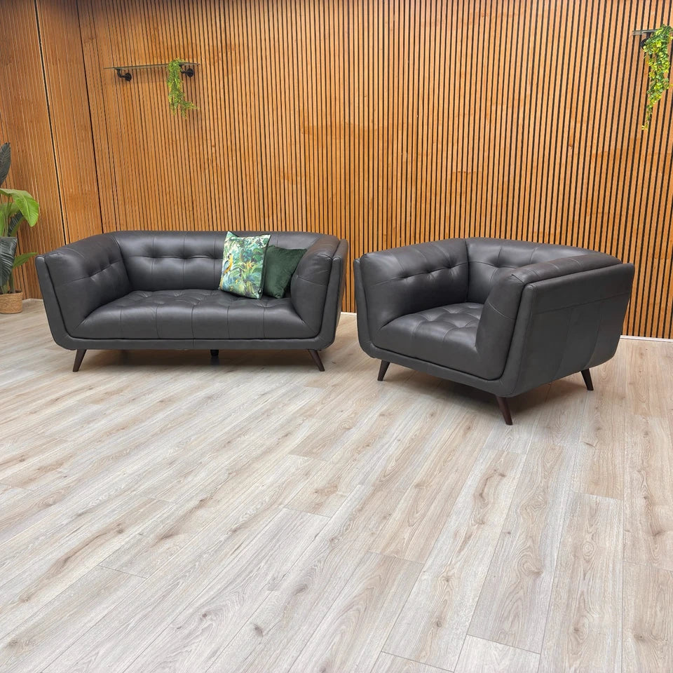 Straight front view of the 'Rene' Navy Blue Leather 2-Seater Sofa, highlighting the comfortable seating and armrests.