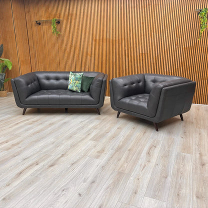 Straight front view of the 'Rene' Navy Blue Leather 2-Seater Sofa, highlighting the comfortable seating and armrests.