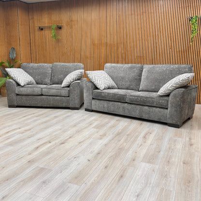 Lifestyle shot of the 'Theodore' Charcoal Grey Sofa Set highlighting the chenille fabric.