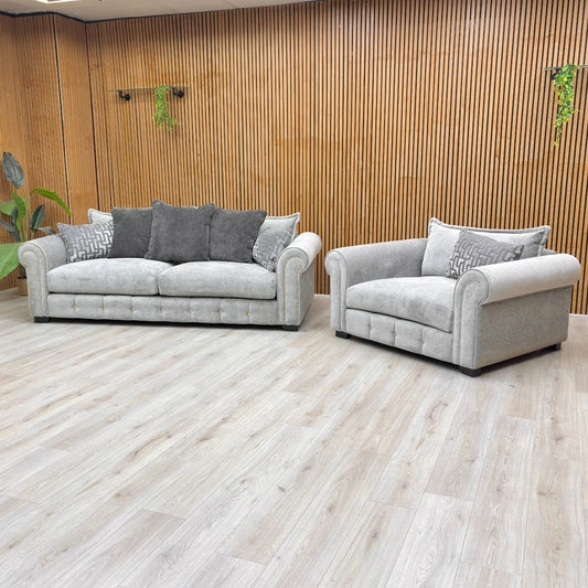 Full set photograph showing the 3 Seater Sofa and Snuggler Chair with generous scatter cushions.