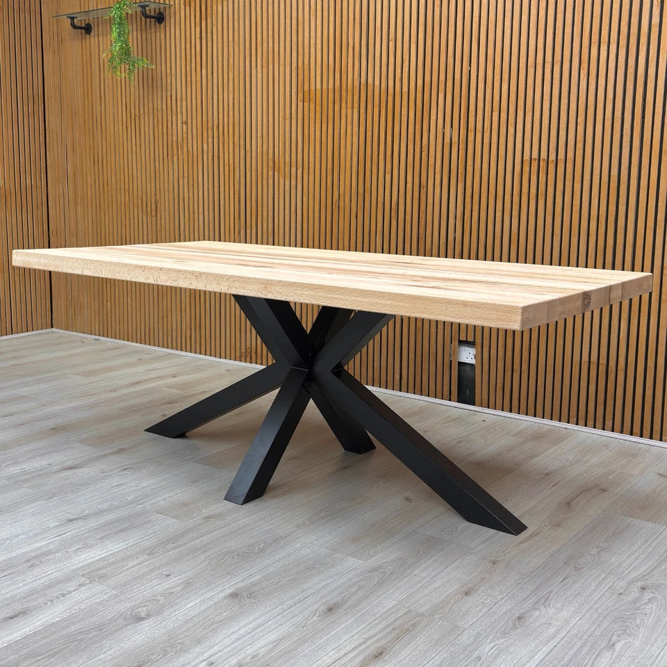 Lifestyle photo showing the Bodahl industrial table set for dining in a modern home environment.