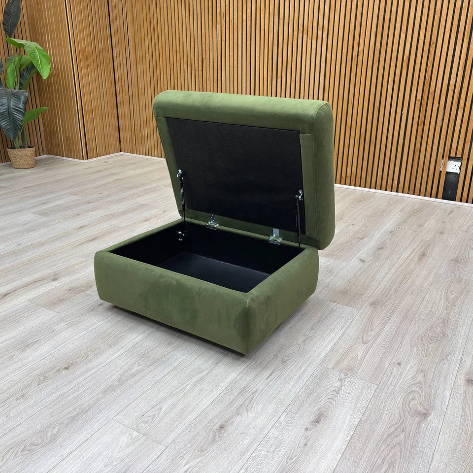 An angled view showing the footstool with the lid open, revealing the internal storage space.