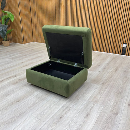 An angled view showing the footstool with the lid open, revealing the internal storage space.