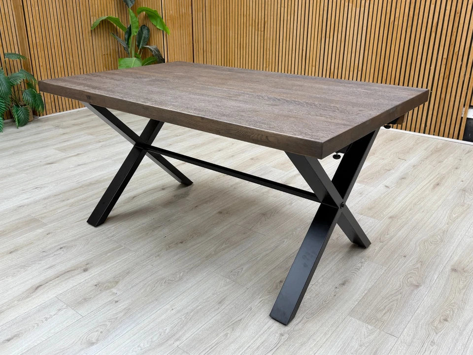 Lifestyle shot showing the 'Mars' Dark Oak 150cm Fixed Dining Table with dining chairs.