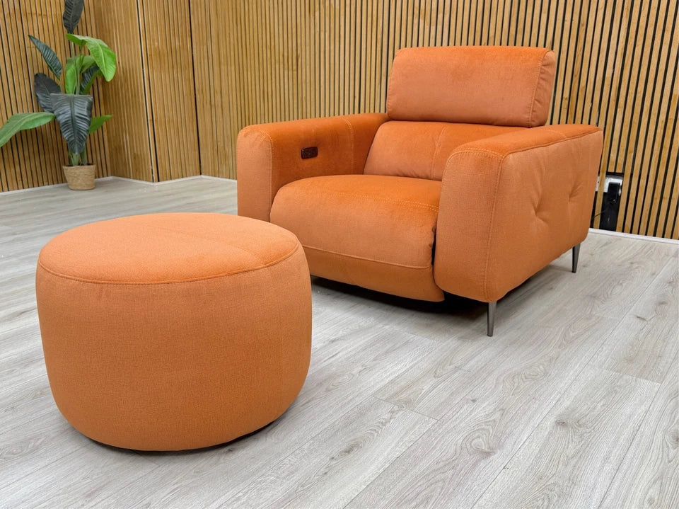 Side profile of the 'Ezra' recliner chair, emphasizing the smooth, modern silhouette and base.