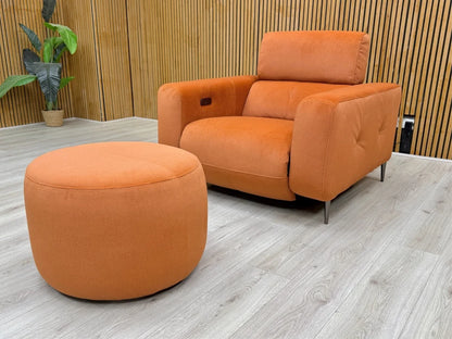 Side profile of the 'Ezra' recliner chair, emphasizing the smooth, modern silhouette and base.