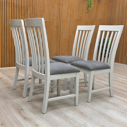 Lifestyle Image of hand-painted grey finish on the Hamilton wooden chairs, showing the paint texture and the clean lines of the furniture.