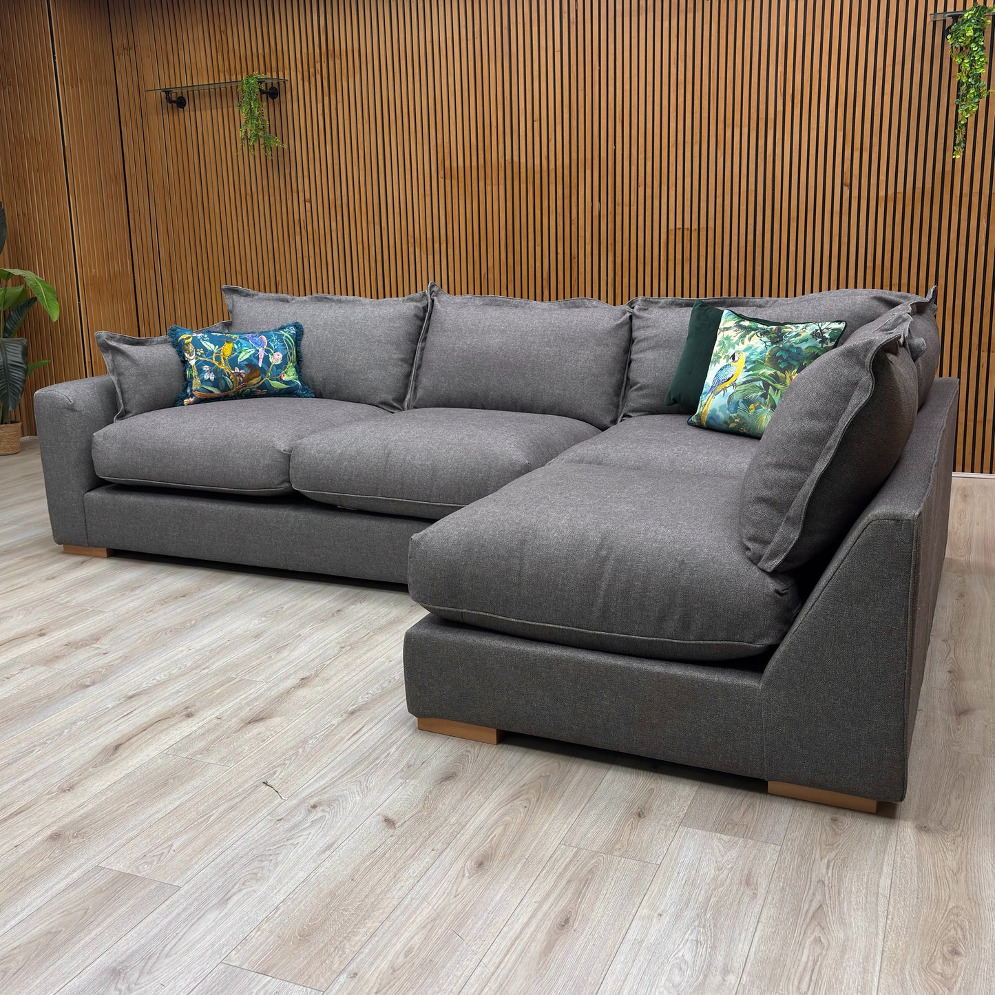 detail of the charcoal grey tight weave fabric on the 'Gaia' sofa, showing the texture and modern feel of the upholstery.