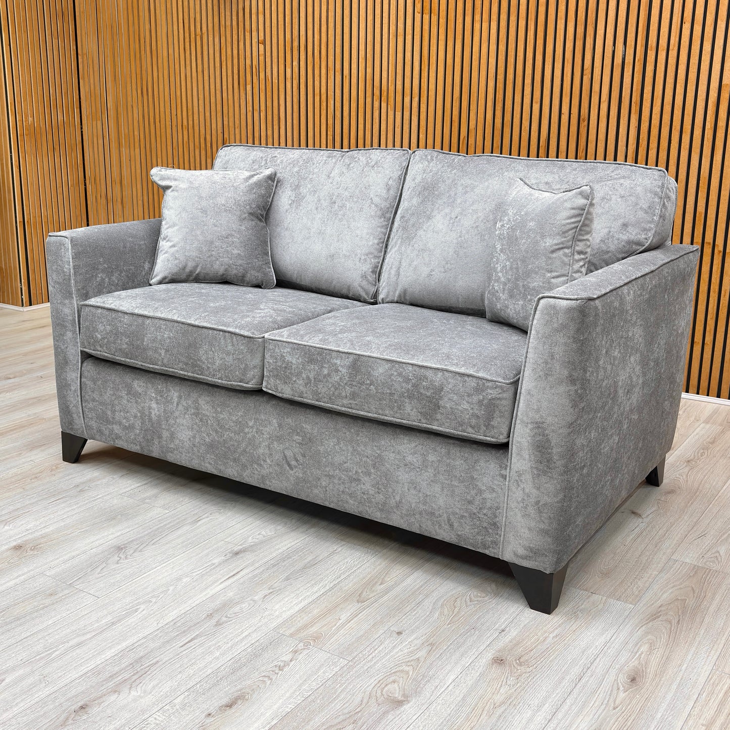 The grey Kingston fabric texture and stitching on the sofa.